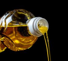 Vegetable oil pouring out of the bottle